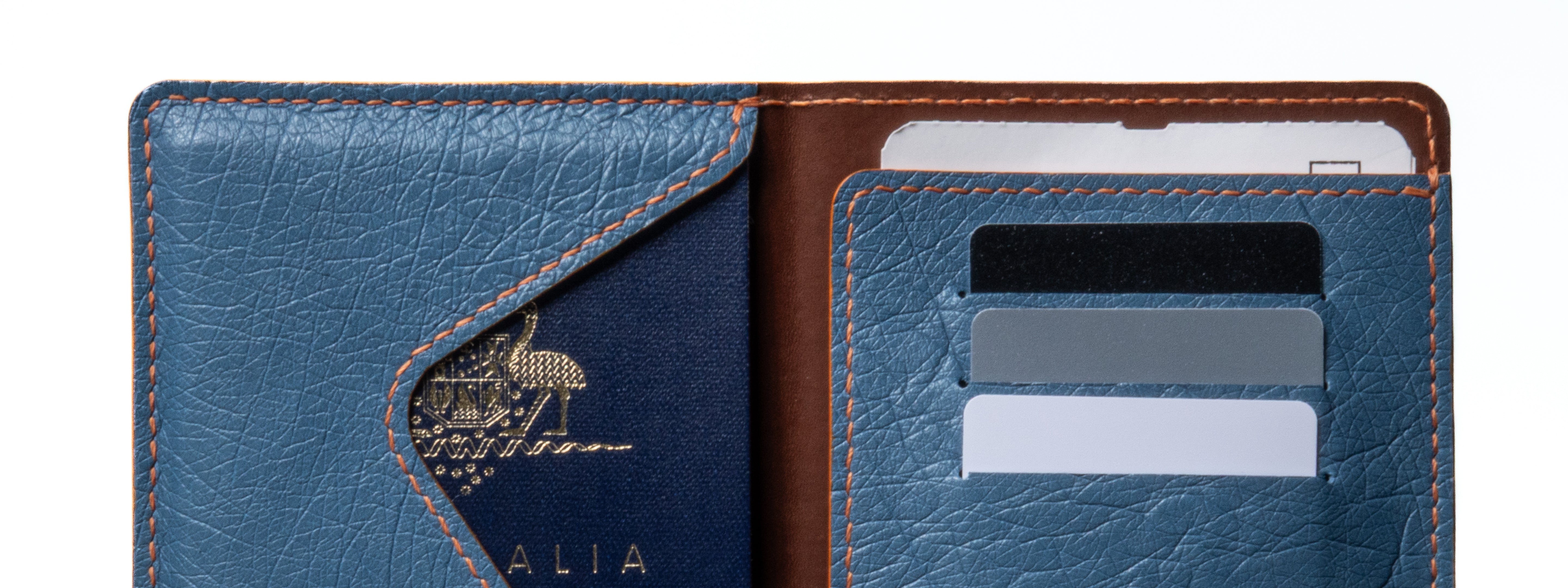 Blue leather wallet with card slots and brand name on a white background